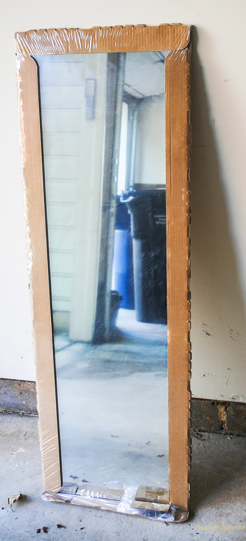 This $10 mirror from IKEA was transitioned into a farmhouse window mirror with a little molding and glue! 