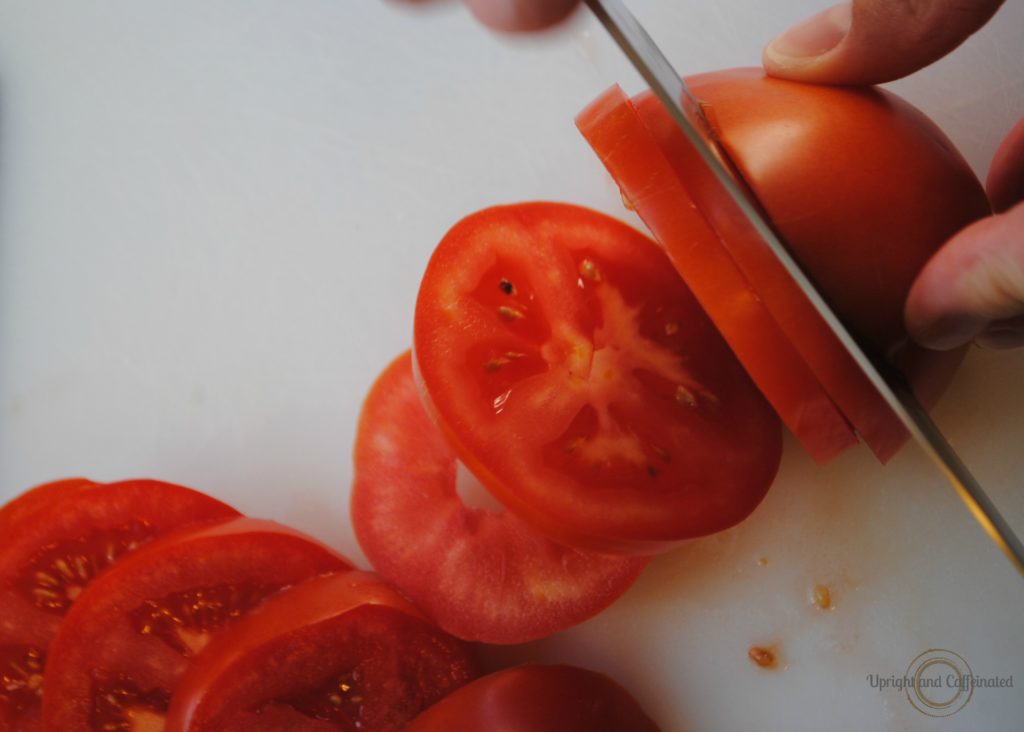 Fresh Tomatoes Being Sliced Parmesan Roasted Tomatoes