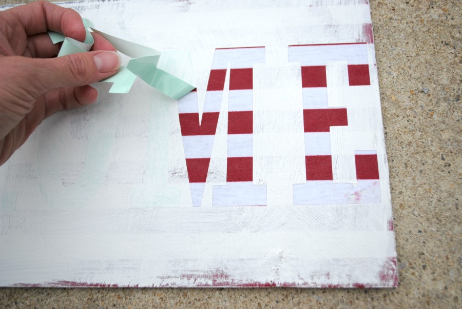 Use vinyl letters cut from a Cricut machine to make this flag sign. 