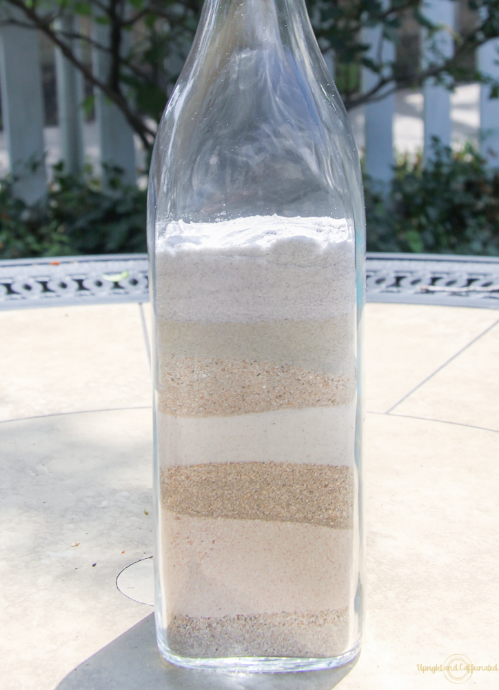 Layered sand, an empty bottle and a Cricut is all it takes to create a DIY beach souvenir. 