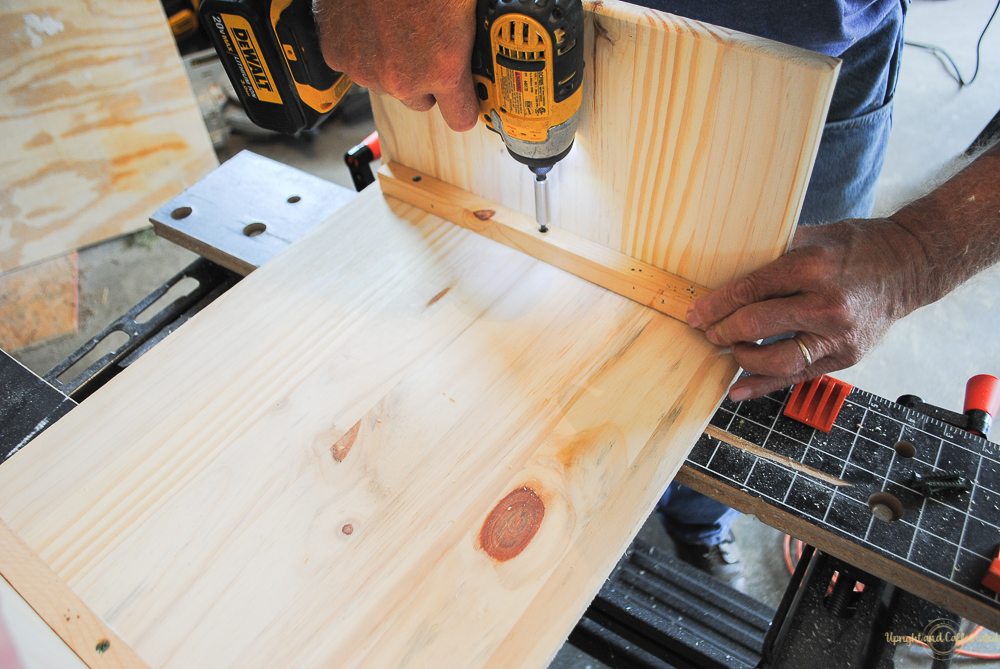 Adding wood braces to this DIY laptop table. 