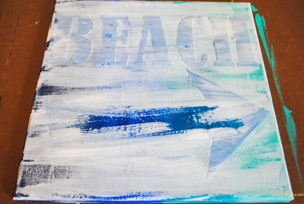 Painting over vinyl is an easy way to make a sign. I'll show you with this beach art project! 