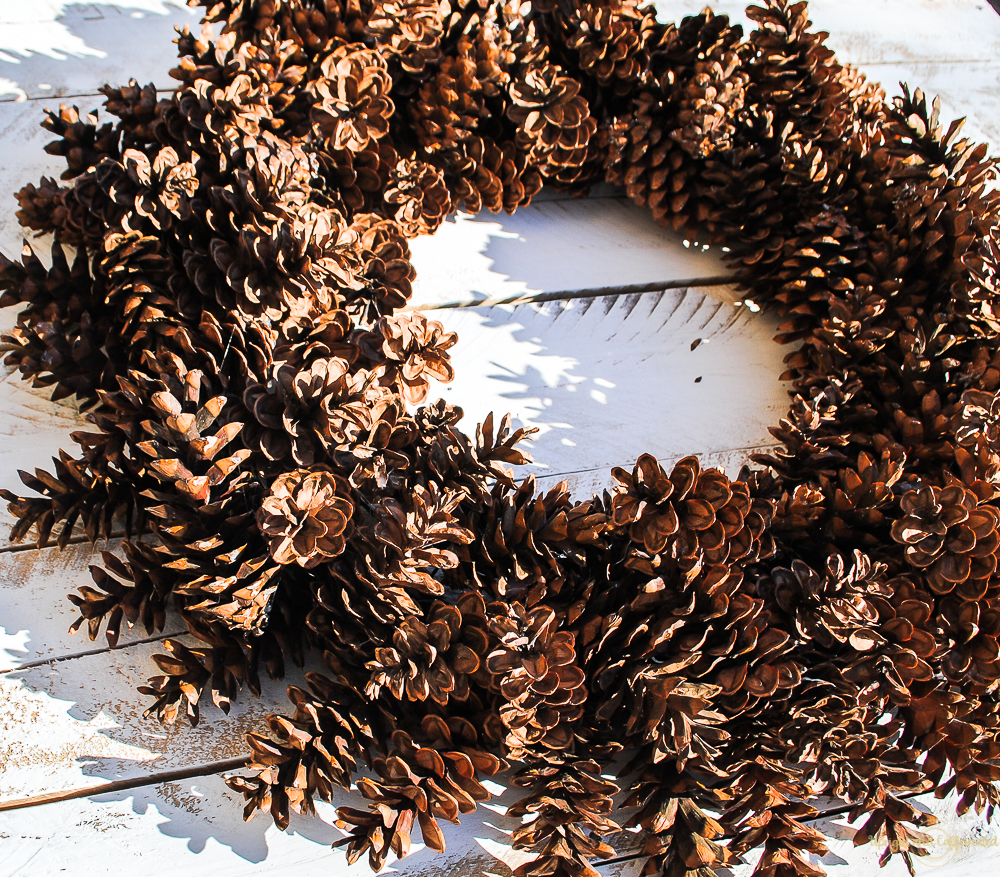 Learn how to make this giant pine cone Christmas wreath. 