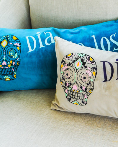 These pillows are made with HTV vinyl and are inspired by Disney's Coco.