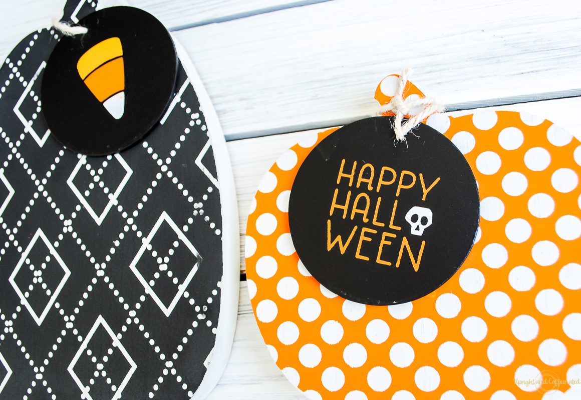 wooden cutout pumpkins with halloween decor