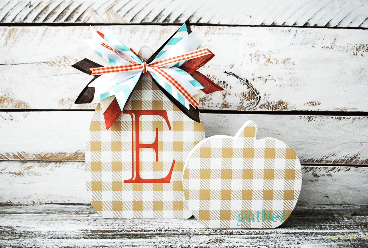 wooden cutouts of a monogram pumpkin